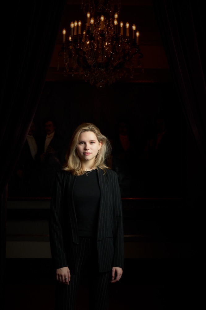 Portrait beneath the chandelier