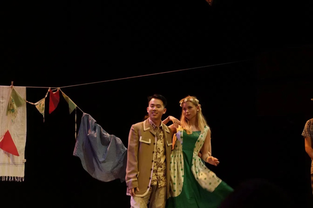 Costumed stage production, with fellow performer
